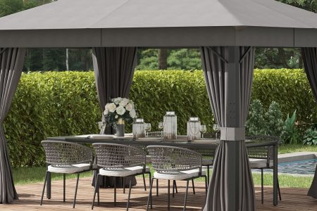 pergola de jardim elegante na cor cinza com um conjunto de mesa e cadeiras embaixo